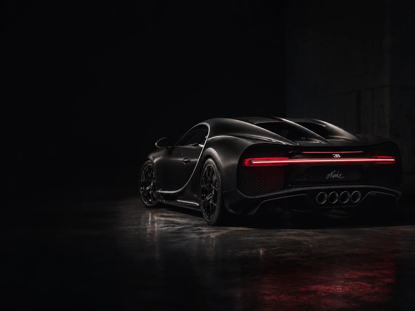 Bugatti Chiron Noire, rear three-quarter — the Noire signature